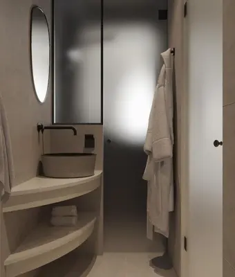 a bathroom with a sink and a mirror at néreya luxury rooms in Haraki