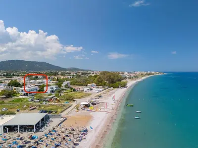 an aerial view of a beach and the ocean at Blue Wave Suites - Ixia in Ialyssos