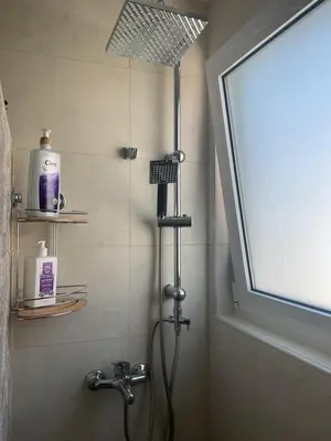 a shower with a shower head in a bathroom at Telis House in Rhodes Town