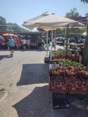 a market with a display of fruits and vegetables at Telis House in Rhodes Town