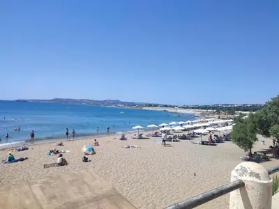 a group of people on a beach near the water at Telis House in Rhodes Town
