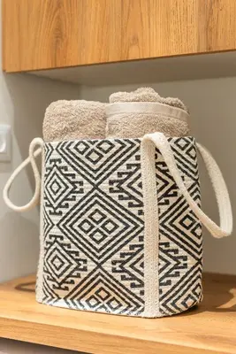 a white and black bag sitting on a shelf at Cozy Suite in Rhodes Town