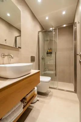 a bathroom with a sink and a shower and a toilet at Cozy Suite in Rhodes Town
