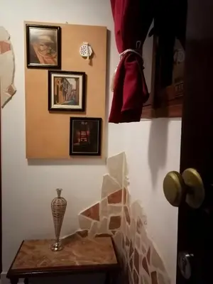 a room with a table and pictures on the wall at Bersimi Lazaridis in Rhodes Town