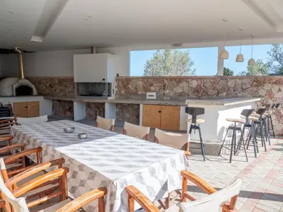 a kitchen and dining room with a table and chairs at Village View Afandou in Afantou