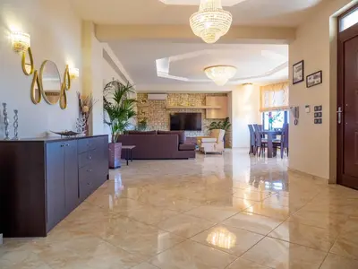 a large living room with a couch and a table at Village View Afandou in Afantou