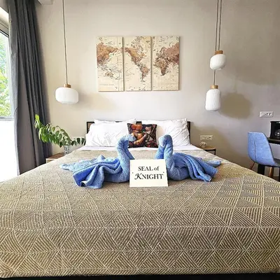 a bedroom with a bed with a sale sign on it at SEAL of Knight - Castle View - Downtown near the Beach in Rhodes Town