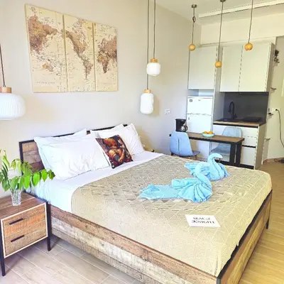 a bedroom with a bed with a towel on it at SEAL of Knight - Castle View - Downtown near the Beach in Rhodes Town
