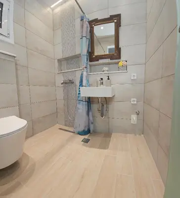 a bathroom with a sink and a toilet at SEAL of Knight - Castle View - Downtown near the Beach in Rhodes Town
