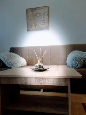 a coffee table with a plate on top of it at MariAggela's Cosy House in Theologos