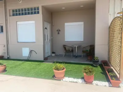 a house with a yard with plants in it at MariAggela's Little House in Theologos