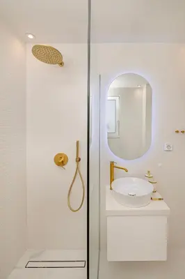 a white bathroom with a sink and a mirror at Villa Petalutha Rhodes in Kolimbia