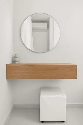 a mirror on a white wall with a white stool at Villa Petalutha Rhodes in Kolimbia