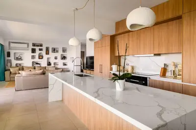 a kitchen with a large marble counter top at Aquarama Pool Apt - Orion in Ixia