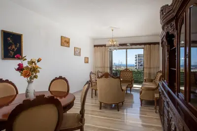 a dining room with a table and chairs at Rhodes Marina Apartment in Rhodes Town