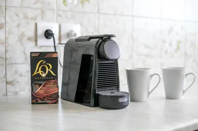 a coffee maker next to two cups on a counter at Rhodes Marina Apartment in Rhodes Town