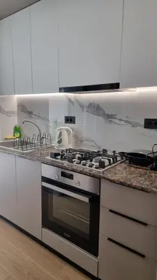 a kitchen with a stove and a sink at Sulaj Apartments in Faliraki