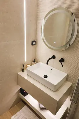 a bathroom with a white sink and a mirror at Sulaj Apartments in Faliraki