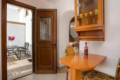 a kitchen with a table with wine glasses on it at Socrates traditional house in Haraki