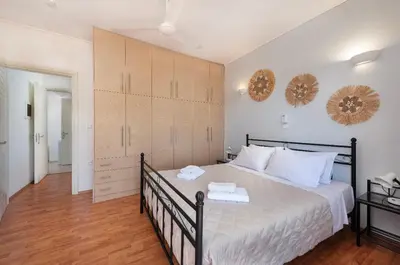 a bedroom with a large bed with two towels on it at Lual Palette Rhodos in Afantou