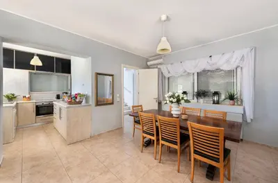 a kitchen and dining room with a table and chairs at Lual Palette Rhodos in Afantou