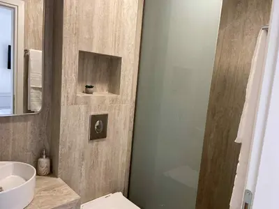 a bathroom with a toilet and a sink at Villa Kennedy in Faliraki