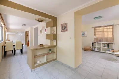 a living room with a kitchen and a dining room at Rhodes Garden Retreat in Rhodes Town