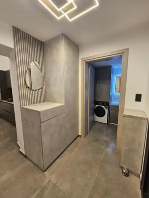 a bathroom with a sink and a mirror on the wall at A&A Niohori Home in Rhodes Town