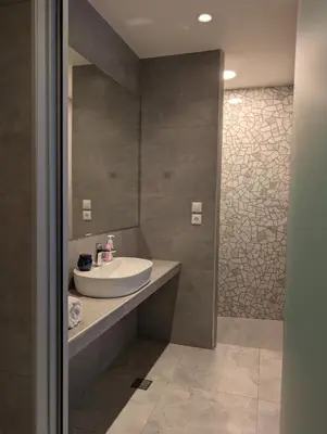 a bathroom with a sink and a mirror at Nirea Studio II in Faliraki