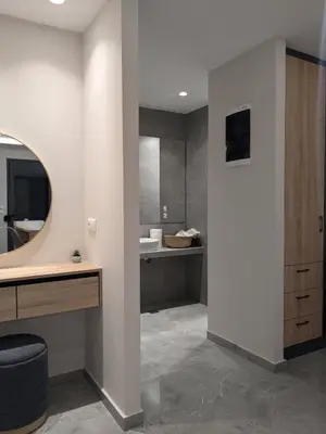 a bathroom with a sink and a mirror at Nirea Studio II in Faliraki
