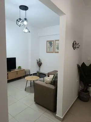 a living room with a couch and a table at Tatti's Apartment in Rhodes Town