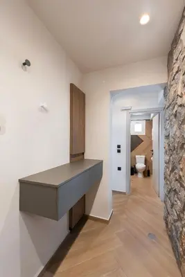 a kitchen with white walls and a counter with a sink at Dolce Casa Suite2 in Afantou