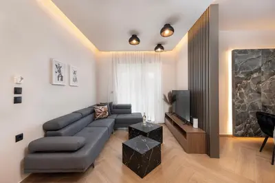 a living room with a couch and a television at Dolce Casa Suite2 in Afantou
