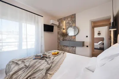a bedroom with a bed with a bowl of fruit on it at Dolce Casa Suite2 in Afantou