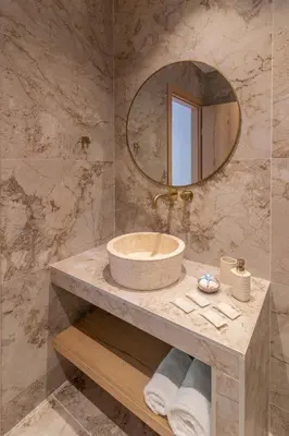 a bathroom with a sink and a mirror at Antonis Traditional House in Afantou