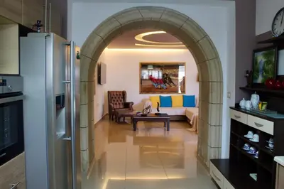 an archway in a kitchen with a living room at Villa Moné in Koskinou