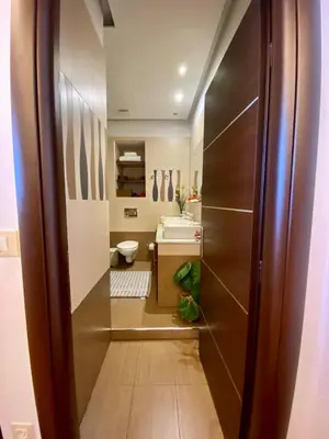 a bathroom with a toilet and a sink at Villa Moné in Koskinou