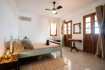a bedroom with a bed and a ceiling fan at Villa Panagiota, Pefkos in Pefki Rhodes