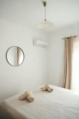 a bedroom with a bed with towels on it at ANASTASIAS HOUSE a in Rhodes Town