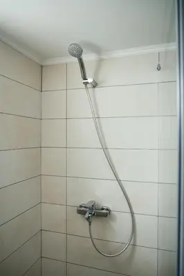 a shower with a shower head in a bathroom at ANASTASIAS HOUSE a in Rhodes Town