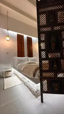 a bedroom with a large bed in a room at H-aris Seafront Mansion in Halki