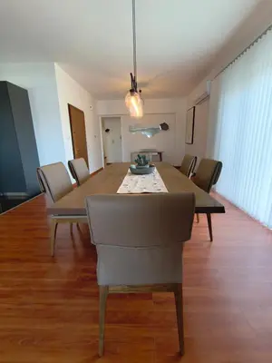 a dining room table and chairs in a room at Downtown Luxury Apartment in Rhodes Town