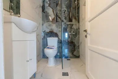 a bathroom with a toilet and a shower at Caserma Regina in Rhodes Town