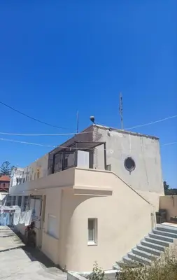 a white building with steps in front of it at Caserma Regina in Rhodes Town