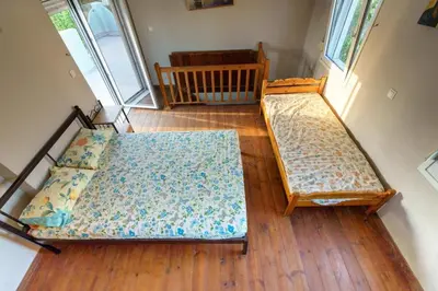 an overhead view of two beds in a room at Private House, Peaceful Stylish Retreat Near Ialisos Beach, up to 5 Guests in Ialyssos