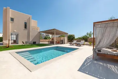 a swimming pool in the backyard of a house at Avia Villa in Pefki Rhodes