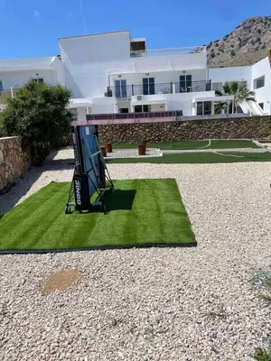 a house with a sign on the grass in front of it at Avia Villa in Pefki Rhodes