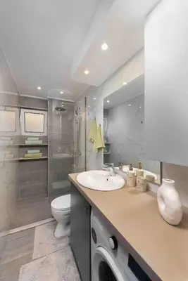 a bathroom with a sink and a washing machine at Modern Colorful House 1 rhodos in Rhodes Town