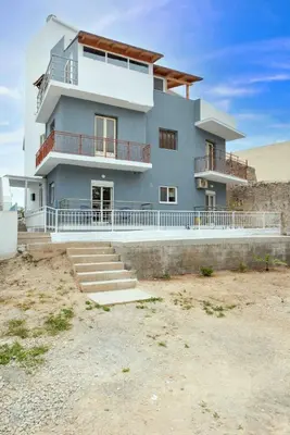 a large house in the middle of the desert at Modern Colorful House 1 rhodos in Rhodes Town