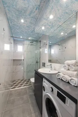 a bathroom with a sink and a washing machine at Modern Colorful House 3 in Rhodes Town